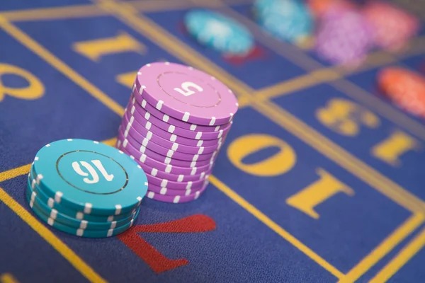 Live baccarat table with dealer and cards
